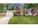 Charming single-story home with well-manicured lawn with large front yard tree at 4300 16Th N Ave, St Petersburg, FL 33713