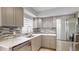 Updated kitchen featuring stainless steel appliances, quartz countertops, and stylish backsplash at 4300 16Th N Ave, St Petersburg, FL 33713