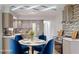 Modern kitchen with stainless steel appliances, breakfast table, and a stylish backsplash, with custom cabinetry at 4300 16Th N Ave, St Petersburg, FL 33713