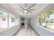 Open-concept living space with large windows, modern fan, and seamless flow into the kitchen area for entertaining at 4300 16Th N Ave, St Petersburg, FL 33713