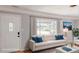 Bright, modern living room with hardwood floors, lots of light, and comfortable furniture at 4300 16Th N Ave, St Petersburg, FL 33713