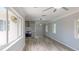 Bright living room area with modern ceiling fan and view into the kitchen at 4300 16Th N Ave, St Petersburg, FL 33713