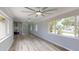 Bright living room area with modern ceiling fan and view into the kitchen at 4300 16Th N Ave, St Petersburg, FL 33713