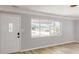 Bright living room with new hardwood floors and a large window at 4300 16Th N Ave, St Petersburg, FL 33713