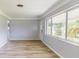 Bright living room with neutral tones and large windows overlooking a landscaped exterior at 4300 16Th N Ave, St Petersburg, FL 33713