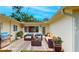 This outdoor patio boasts a grill, plenty of seating, and planters adding to the outdoor charm at 4300 16Th N Ave, St Petersburg, FL 33713