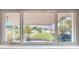 A view from the window showing a landscaped lawn and decorative iron work at 4300 16Th N Ave, St Petersburg, FL 33713