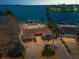 Waterfront home featuring lush landscaping, a private dock, and a brick driveway at 4381 Poinsettia Dr, St Pete Beach, FL 33706