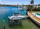 Waterfront home with dock, boat lift, and easy access to beautiful waterways and coastal living at 4381 Poinsettia Dr, St Pete Beach, FL 33706