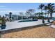 A backyard oasis featuring a pool, patio, and stunning waterfront views at 4381 Poinsettia Dr, St Pete Beach, FL 33706