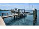 Dock with boat lift offering easy access to the water and picturesque waterfront living at 4381 Poinsettia Dr, St Pete Beach, FL 33706