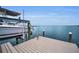 Private dock with boat lift and tranquil water views is perfect for boating enthusiasts at 4381 Poinsettia Dr, St Pete Beach, FL 33706
