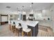 Spacious kitchen with stainless steel appliances, white countertops, and a large island with barstools at 4381 Poinsettia Dr, St Pete Beach, FL 33706