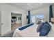Comfortable main bedroom with views of the living room, waterfront patio and bay at 4381 Poinsettia Dr, St Pete Beach, FL 33706
