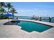 Gorgeous pool and dock with boat lift overlooking the water at 4381 Poinsettia Dr, St Pete Beach, FL 33706