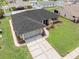 Aerial view of the home with well-kept lawn, driveway, and stylish entrance, offering great curb appeal at 4530 Zack Dr, New Port Richey, FL 34653