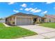 Charming single-story home with a well-maintained lawn and a screened garage at 4530 Zack Dr, New Port Richey, FL 34653