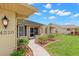 Inviting front entrance with landscaped walkway and decorative pillars leading to the front door at 4530 Zack Dr, New Port Richey, FL 34653