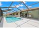 Backyard pool area with a covered patio, perfect for relaxing and enjoying the outdoors at 4530 Zack Dr, New Port Richey, FL 34653