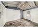 Cozy bonus room with white and blue walls, wood-look flooring, and a back door at 4570 Essex Ln, Spring Hill, FL 34606