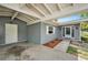 Covered parking and entrance to a light gray single-story home at 4570 Essex Ln, Spring Hill, FL 34606