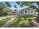 Charming single-story home featuring a carport, well-maintained lawn, and quaint curb appeal at 4570 Essex Ln, Spring Hill, FL 34606
