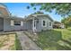 Inviting single-story home showcasing a well-maintained front yard and a cozy entrance at 4570 Essex Ln, Spring Hill, FL 34606