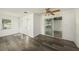 Bright, open-concept living room with modern wood flooring and a sliding glass door at 4570 Essex Ln, Spring Hill, FL 34606