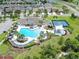 Resort-style community pool, splash pad, and tennis courts offer luxury living and recreational activities at 4902 Grist Mill Ct, Wimauma, FL 33598