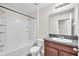 Bright bathroom with vanity cabinet, shower, and tub combination at 4902 Grist Mill Ct, Wimauma, FL 33598