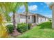 Charming one-story home featuring manicured lawn and attached two-car garage at 4902 Grist Mill Ct, Wimauma, FL 33598