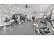 Well-equipped fitness center features modern exercise equipment, mirrors, and plenty of natural light at 4902 Grist Mill Ct, Wimauma, FL 33598