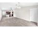 Open living space featuring tile floors, neutral paint, updated lighting fixtures, and an open concept layout at 4902 Grist Mill Ct, Wimauma, FL 33598