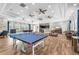 Large recreation room with a ping pong table is perfect for entertaining guests and fun activities at 4902 Grist Mill Ct, Wimauma, FL 33598