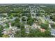 Neighborhood aerial view showcases tree-lined streets and well-maintained homes in a serene setting at 4906 Presidential St, Seffner, FL 33584