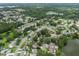 An aerial view showcasing a neighborhood with mature landscaping, several ponds, and easy access to main roads at 4906 Presidential St, Seffner, FL 33584