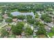 Scenic aerial view of the community, featuring a pond and tree-lined streets, creating a tranquil ambiance at 4906 Presidential St, Seffner, FL 33584