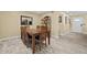Formal dining room showcases a wooden table for six and modern accents at 4906 Presidential St, Seffner, FL 33584