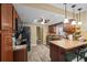 Kitchen featuring wood cabinets and tile backsplash at 4906 Presidential St, Seffner, FL 33584
