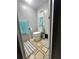 Cozy bathroom featuring neutral color palette, toilet, window, and stylish decorative mats at 5248 Antigua Dr, Zephyrhills, FL 33541