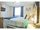 Comfortable main bedroom with a large window and ceiling fan at 5248 Antigua Dr, Zephyrhills, FL 33541