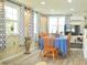 Dining room with wood table and natural light at 5248 Antigua Dr, Zephyrhills, FL 33541