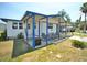 Charming single-story home with a covered porch, landscaped yard, and curb appeal at 5248 Antigua Dr, Zephyrhills, FL 33541