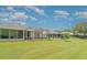 Lush backyard featuring multiple screened lanais, perfect for enjoying the outdoors in a private setting at 5814 Heronpark Pl, Lithia, FL 33547