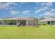 A beautiful backyard with a screened lanai and well-manicured lawn, perfect for outdoor relaxation and entertainment at 5814 Heronpark Pl, Lithia, FL 33547