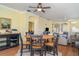 Open dining area with hardwood floors connecting to the living room and kitchen at 5814 Heronpark Pl, Lithia, FL 33547