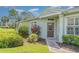 Inviting front entrance featuring beautiful landscaping and a well-lit pathway at 5814 Heronpark Pl, Lithia, FL 33547