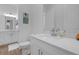 Clean bathroom featuring a white vanity with quartz countertop and modern fixtures at 6602 S Sherrill St, Tampa, FL 33616