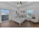 Light and airy bedroom featuring a tray ceiling, private deck, and water view at 6602 S Sherrill St, Tampa, FL 33616
