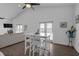 An open concept dining area and kitchen featuring vaulted ceilings and an open concept floor plan at 6602 S Sherrill St, Tampa, FL 33616